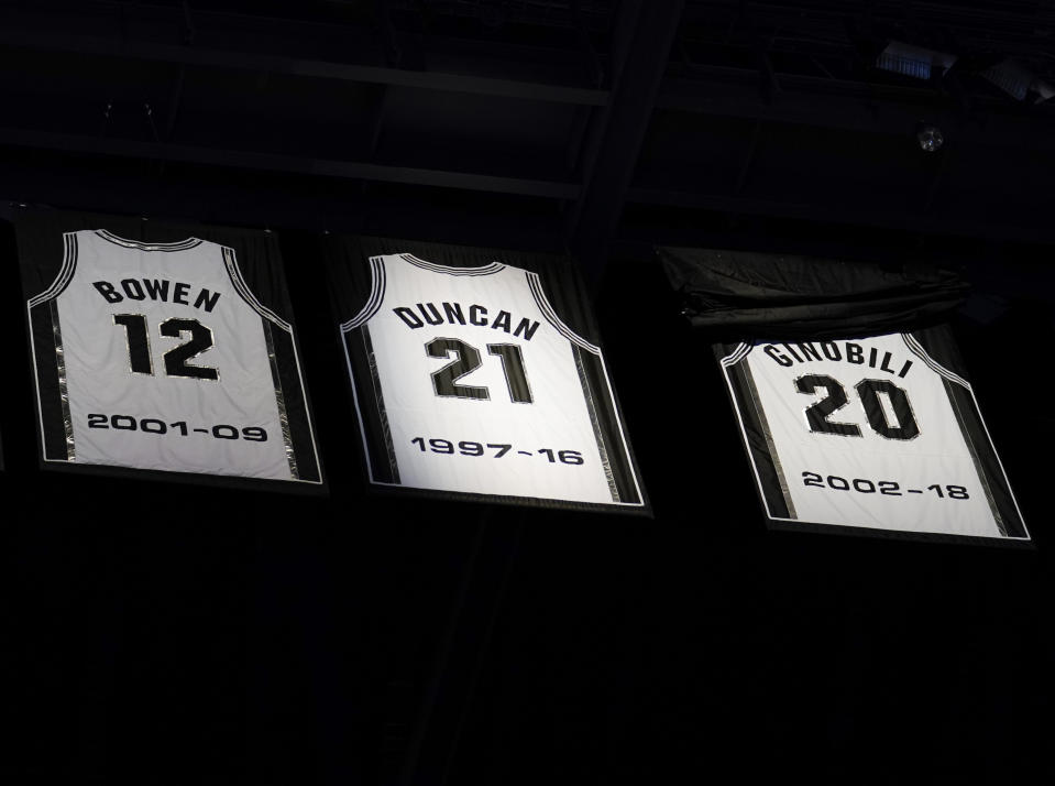 Former San Antonio Spurs guard Manu Ginobili's jersey is unveiled in the rafters of the AT&T Center during his retirement ceremony, after the team's NBA basketball game against the Cleveland Cavaliers, Thursday, March 28, 2019, in San Antonio. San Antonio won 116-110. (AP Photo/Darren Abate)