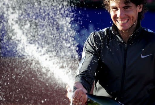 Spanish Rafael Nadal sprays cava after winning the final of the Barcelona Open tennis tournament Conde de Godo against compatriot David Ferrer. Nadal won 7-6, 7-5 and, once again, confirmed his status as king of clay after winning his seventh Barcelona Open title