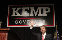 Georgia Republican gubernatorial candidate Brian Kemp waves before speaking to supporters Wednesday, Nov. 7, 2018, in Athens, Ga. (AP Photo/John Bazemore)