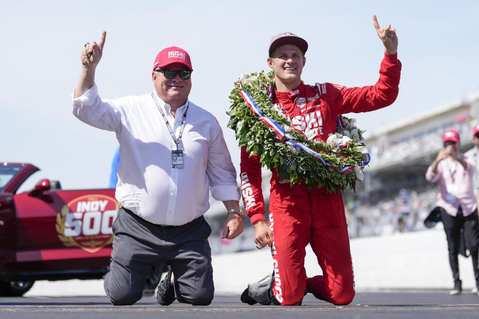 Marcus Ericsson, right, of Sweden, celebrates with car owner Chip Ganassi after winning the Indianapolis 500 auto race at Indianapolis Motor Speedway in Indianapolis, Sunday, May 29, 2022. (AP Photo/AJ Mast)