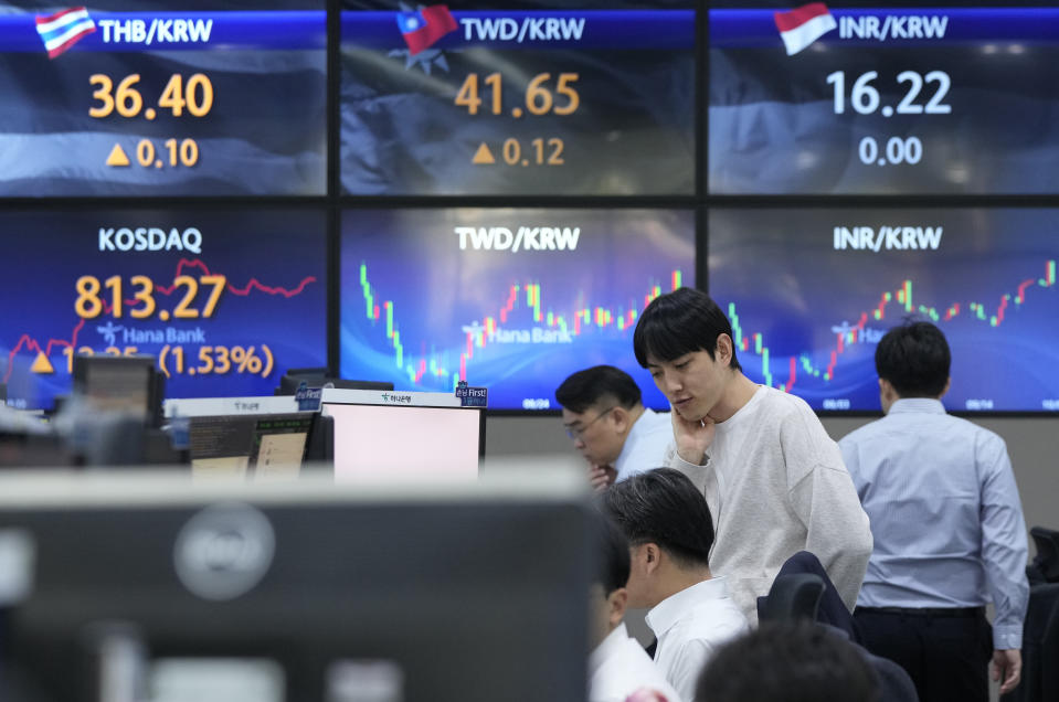 Currency traders work at the foreign exchange dealing room of the KEB Hana Bank headquarters in Seoul, South Korea, Friday, Oct. 6, 2023. Asian shares mostly rose in cautious trading Friday after Wall Street drifted to a quiet close on worries about a too-hot U.S. job. (AP Photo/Ahn Young-joon)