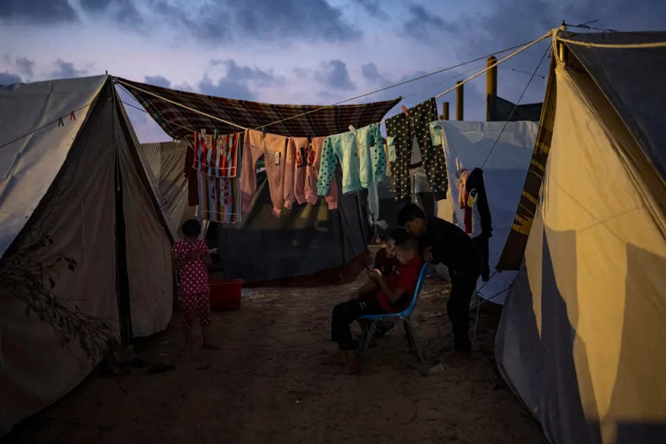 Palestinian children at a UN-provided tent camp in Khan Younis (AP)