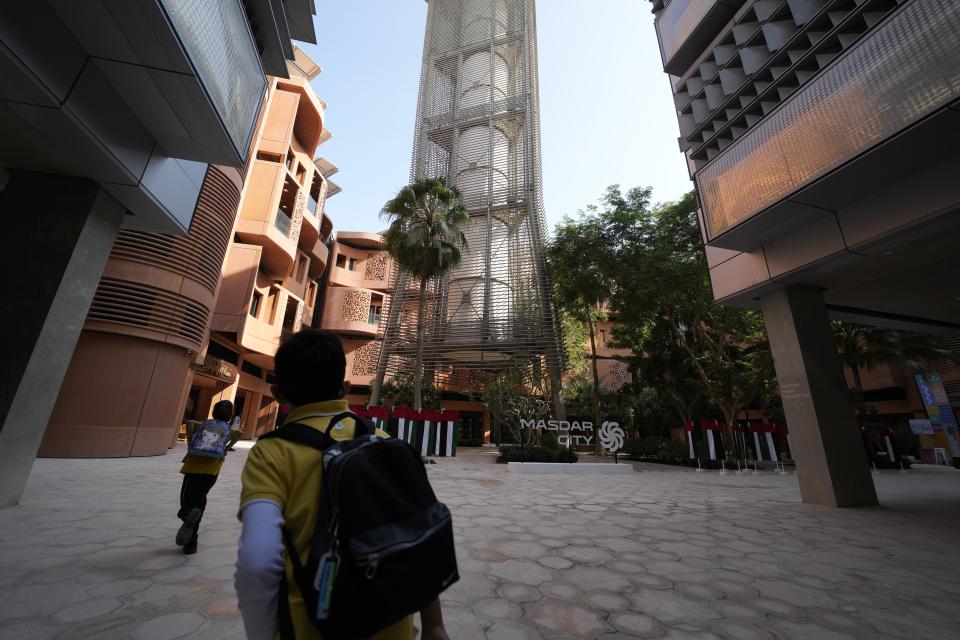 Students visit Masdar City near Abu Dhabi, United Arab Emirates, as Dubai hosts the COP28 U.N. Climate Summit, Friday, Dec. 8, 2023. (AP Photo/Kamran Jebreili)