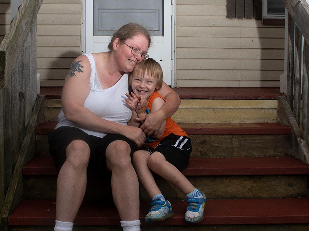 Lindsey Stone with her son Joey Stone, 5, on the porch of their Ravenna home. Joey, who ends his day at West Park, Ravenna's kindergarten building, at about 3:45 p.m., didn't arrive home until 6:45 p.m. Wednesday.