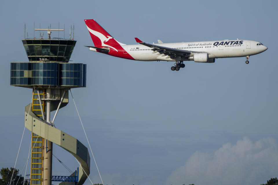 A Qantas passenger jet prepares to land at Sydney Airport, Australia, Monday, Sept. 5, 2022. (AP Photo/Mark Baker)