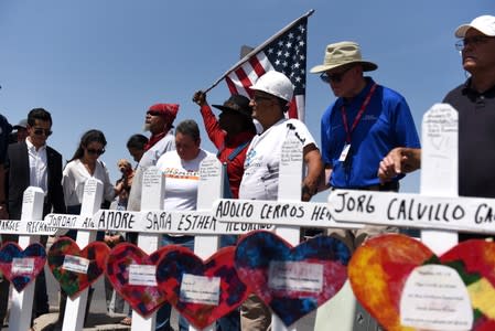 People pay their respects two days after a mass shooting in El Paso