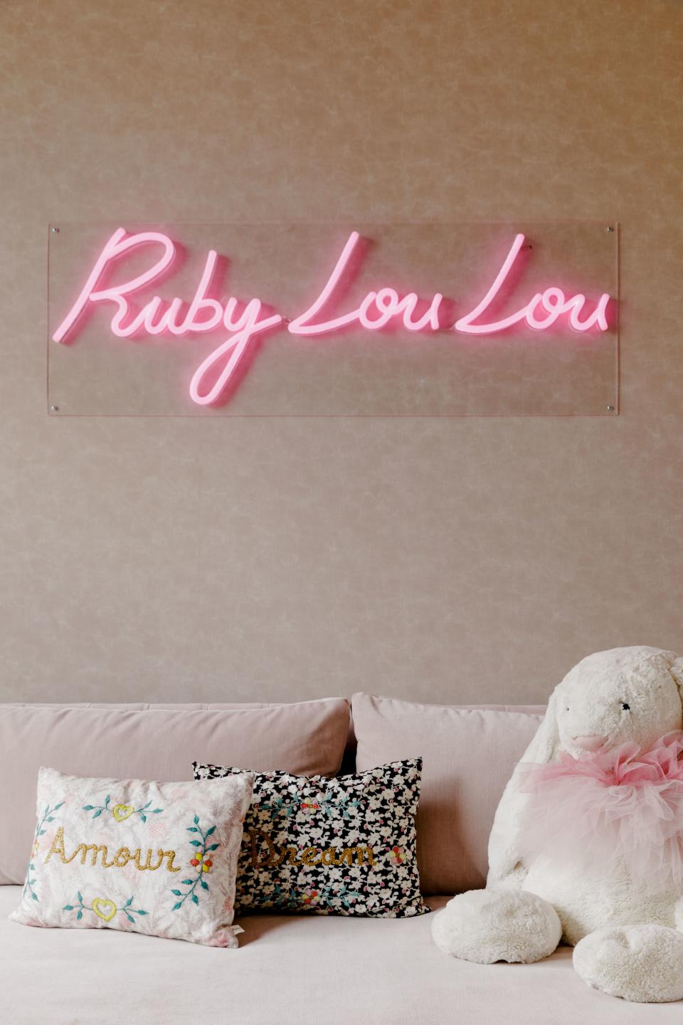 Ruby’s custom neon sign in her bedroom is from Name Glo. “They made one for my office as well. It's just such a cool concept,” Charnas says.