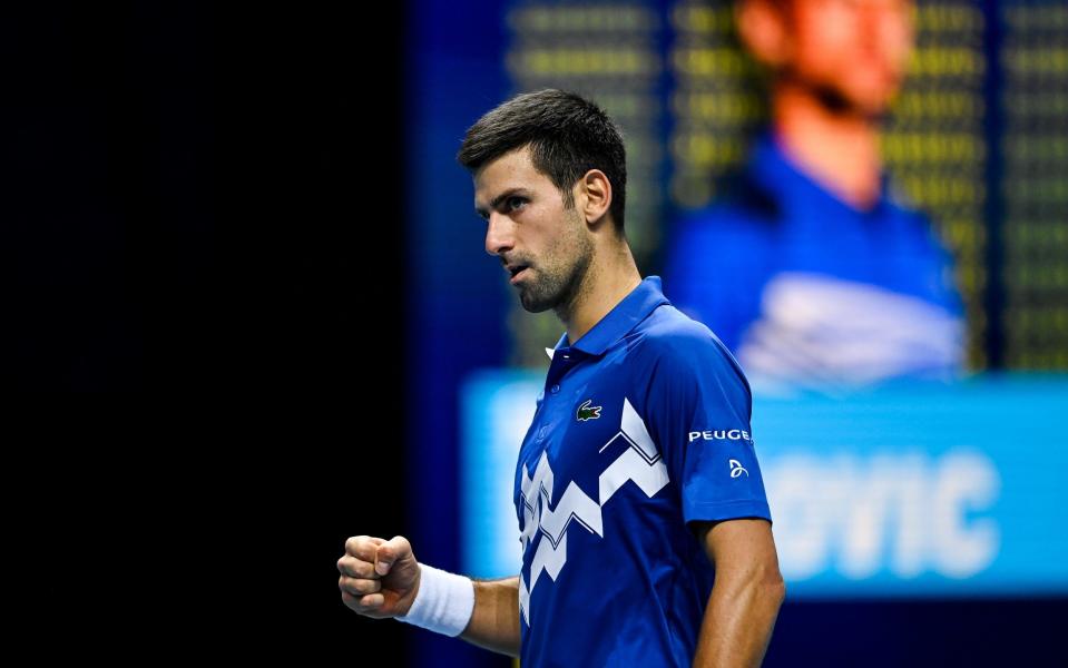 Novak Djokovic of Serbia celebrates his victory over Alexander Zverev of Germany on Day 6 of the Nitto ATP World Tour Finals at The O2 Arena on November 20, 2020 in London, England. - GETTY IMAGES