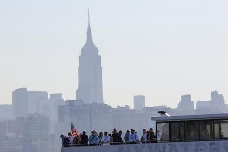 People take the ferry to commute to New York city from the Hoboken Terminal in New Jersey, U.S., July 10, 2017. REUTERS/Eduardo Munoz