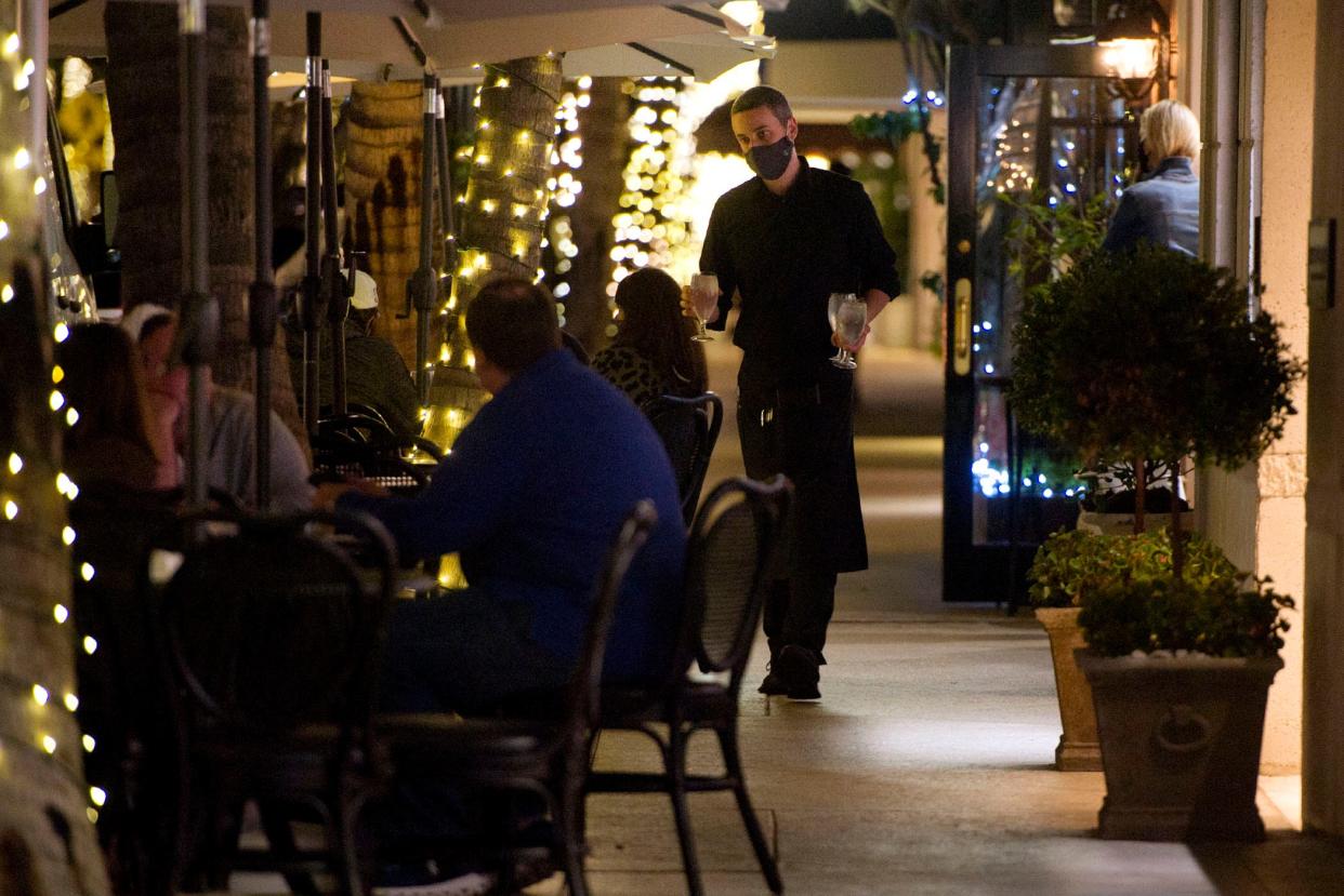 Diners take advantage of cool weather and outdoor seating Jan. 4 at Ta-boo. The restaurant is one of 20 that is part of a temporary outdoor-seating program run by the town. The program has been extended until Labor Day.