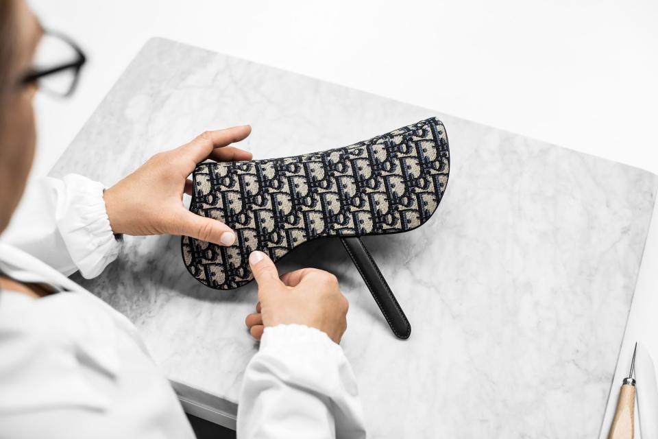 Maria Grazia Chiuri’s new twist on the iconic saddlebag is launching in Dior boutiques today. Here, the house shared exclusive photos and videos to show how each one is made.