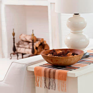 Drape a Winter scarf across a console table for an instant decorating lift. 

Source