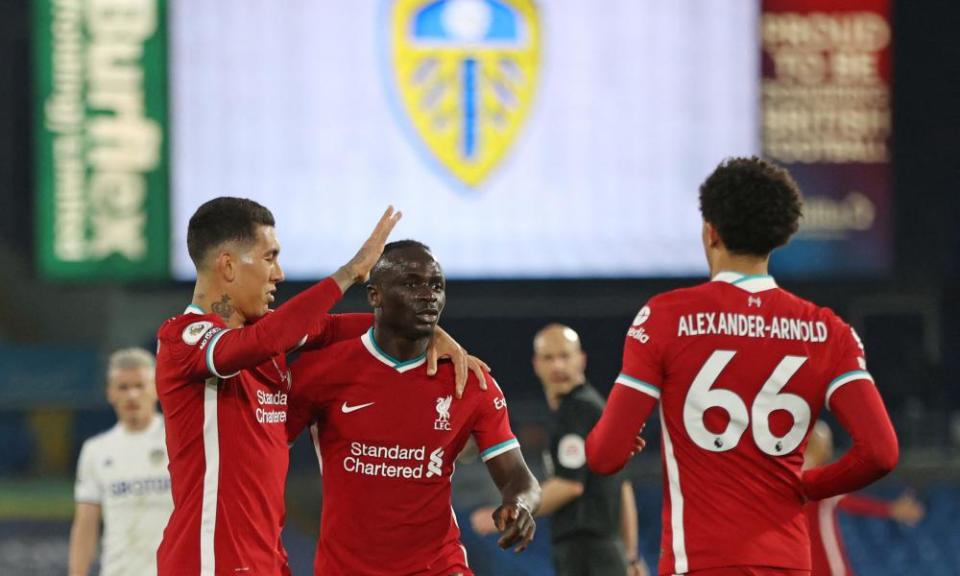 Sadio Mané celebrates his goal with Roberto Firmino and Trent Alexander-Arnold.