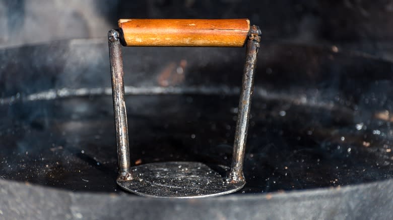 burger smasher in cast iron