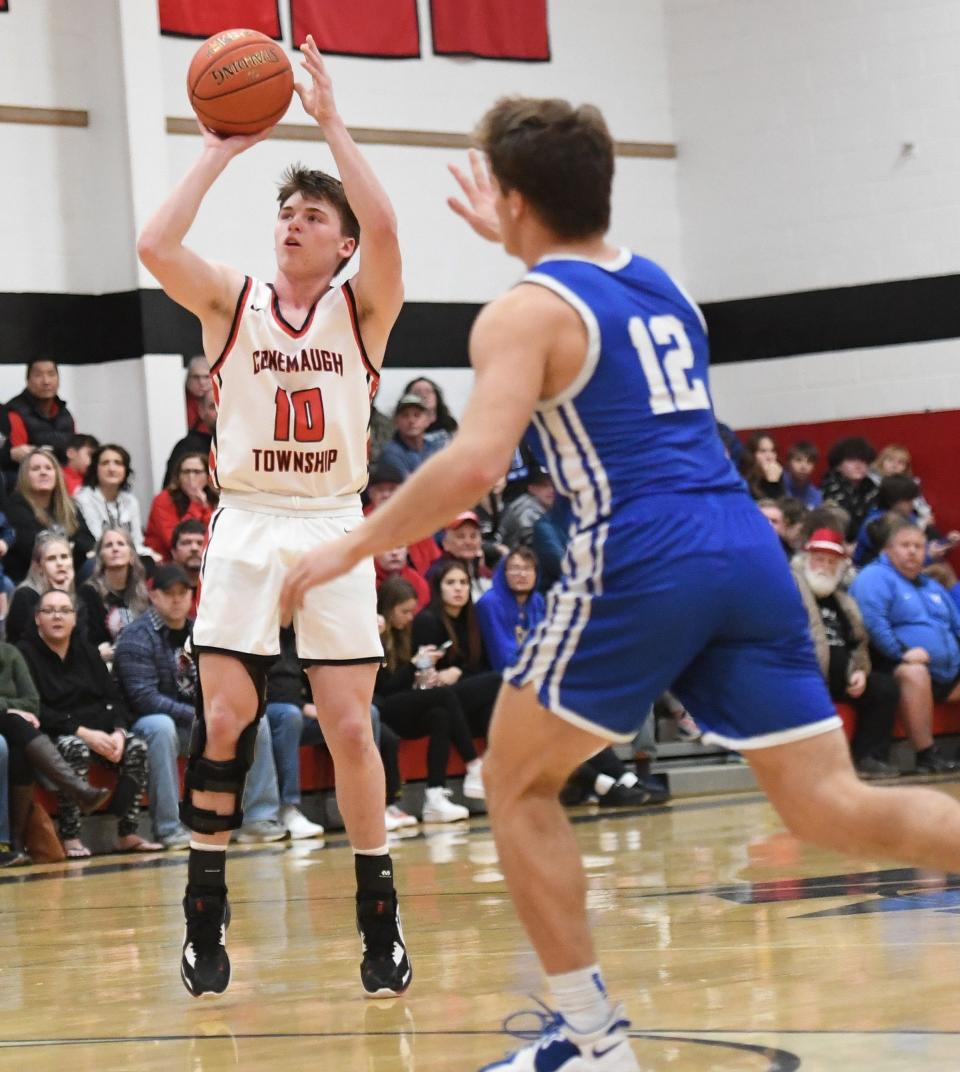 Conemaugh Township's Tanner Shirley (10) knocks down a second-half 3-pointer in front of Windber's John Shuster (12) during a boys WestPAC basketball contest, Jan. 5, in Davidsville.