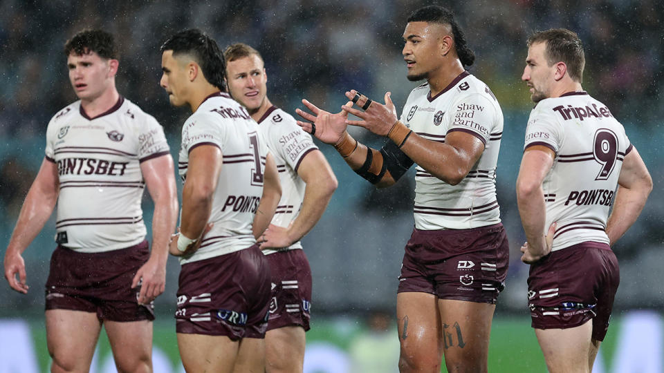 Manly players look dejected during their NRL clash against Canterbury.