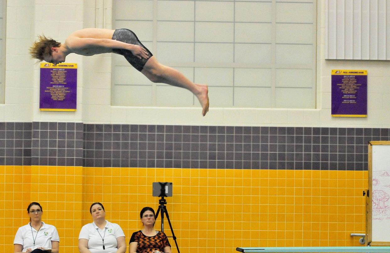 Ashland High School’s Owen Lemon dives during a swim meet against Ontario High School at Ashland University Tuesday, Feb. 1, 2022. LIZ A. HOSFELD/FOR TIMES-GAZETTE.COM