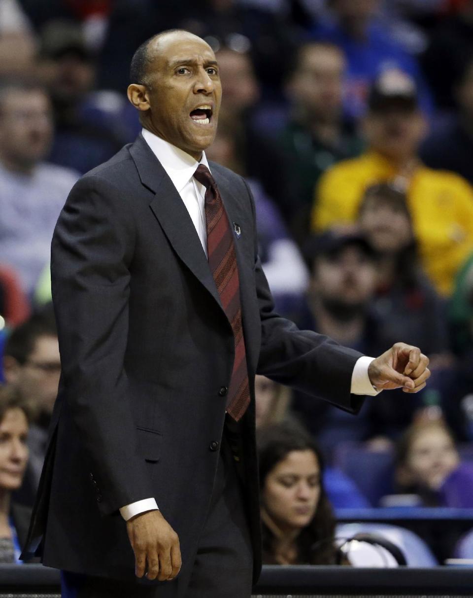 Stanford head coach Johnny Dawkins yells from the sidelines during the first half of a third-round game against Kansas of the NCAA college basketball tournament Sunday, March 23, 2014, in St. Louis. (AP Photo/Jeff Roberson)