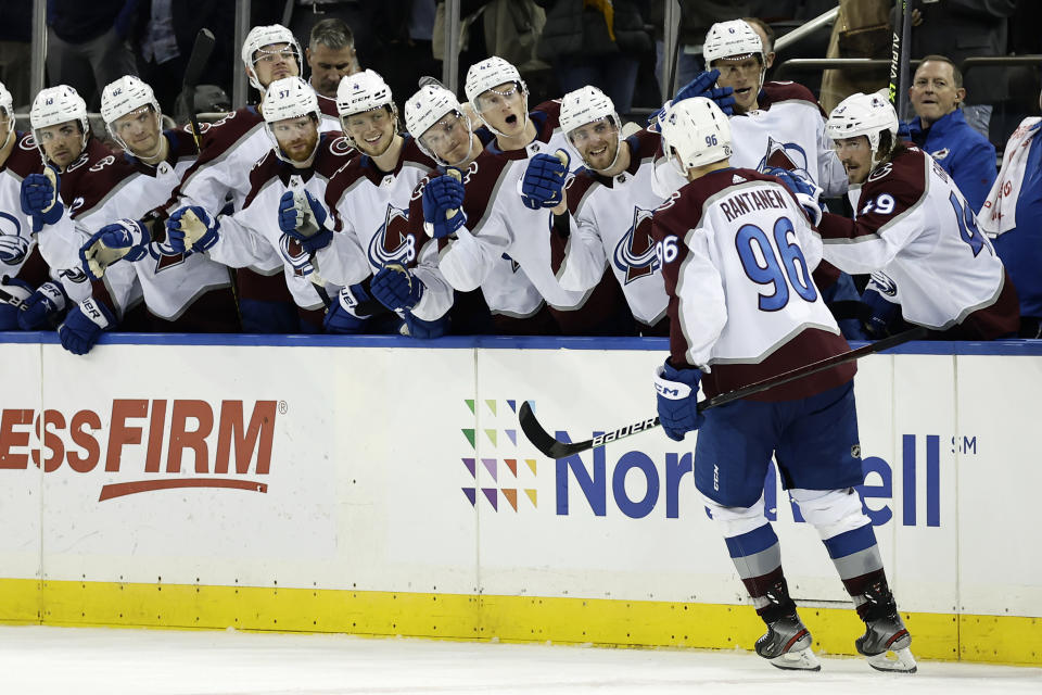 Colorado Avalanche right wing Mikko Rantanen (96) celebrates with teammates after scoring a goal against the New York Rangers during a shootout in an NHL hockey game Tuesday, Oct. 25, 2022, in New York. The Avalanche won 3-2 in a shootout. (AP Photo/Adam Hunger)