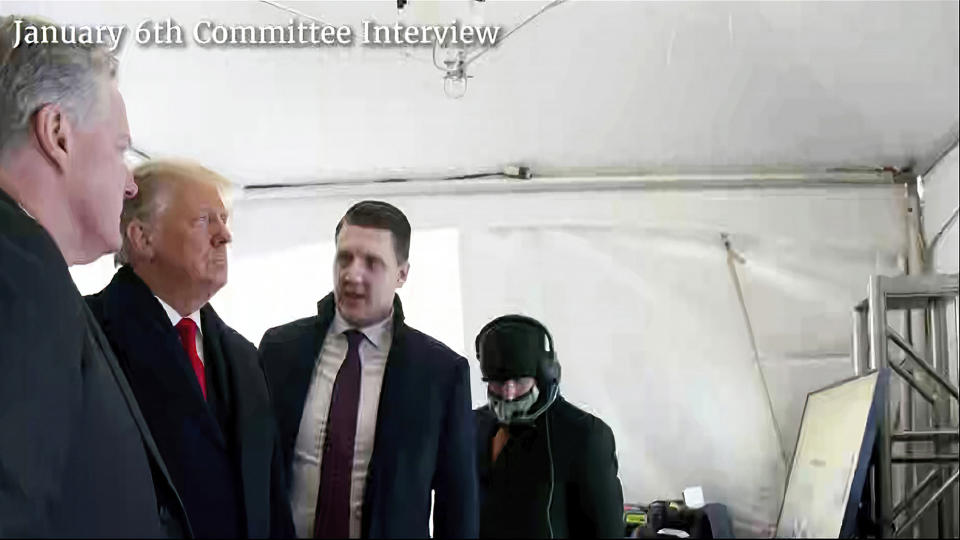 A photo featured by the House Jan. 6 committee of then-President Donald Trump talking to his chief of staff, Mark Meadows, and aide William Russell before Trump's speech on the morning of Jan. 6, 2021. (House Select Committee via AP file)