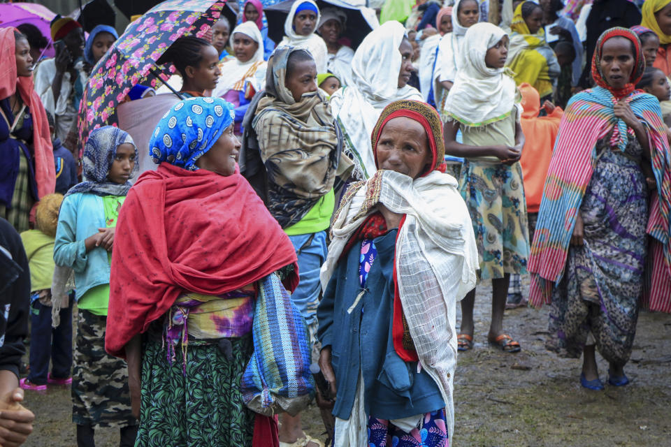 Displaced Amharas from different villages now controlled by Tigrayan forces in the North Gondar zone, gather in a kindergarten school housing the internally-displaced, in Debark, in the Amhara region of northern Ethiopia Wednesday, Aug. 25, 2021. As they bring war to other parts of Ethiopia such as the Amhara region, resurgent Tigray fighters face growing allegations that they are retaliating for the abuses their people suffered back home, sending hundreds of thousands of people fleeing in the past two months. (AP Photo)