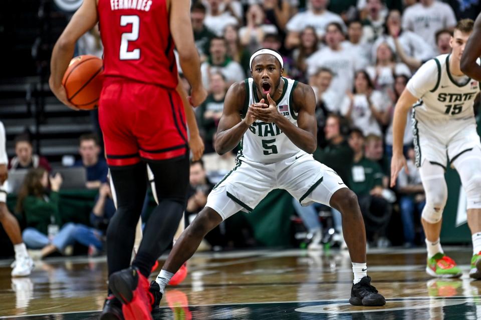 Michigan State's Tre Holloman celebrates after Tyson Walker's 3-pointer against Rutgers during the second half on Sunday, Jan. 14, 2024, at the Breslin Center in East Lansing.