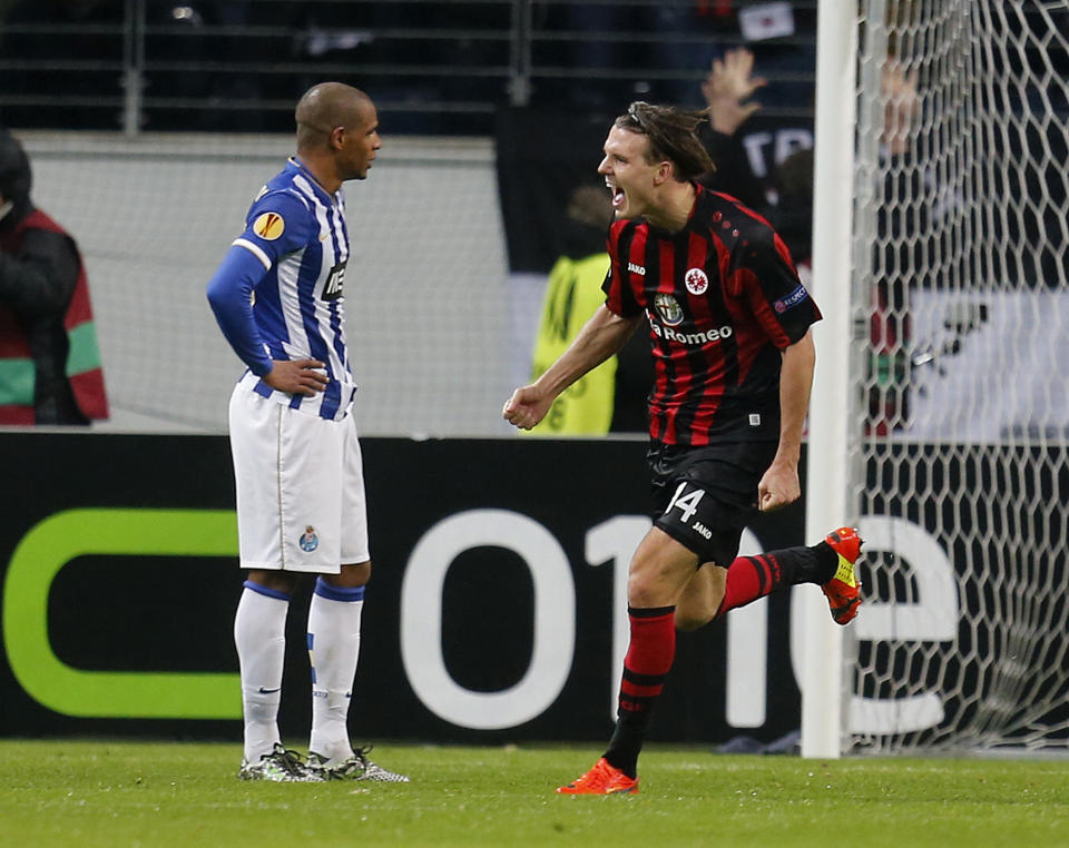 Frankfurt's Alexander Meier celebrates his side's third goal during a Europa League round of 32 second leg soccer match between Eintracht Frankfurt and FC Porto in Frankfurt, Germany, Thursday, Feb. 27, 2014. (AP Photo/Michael Probst)