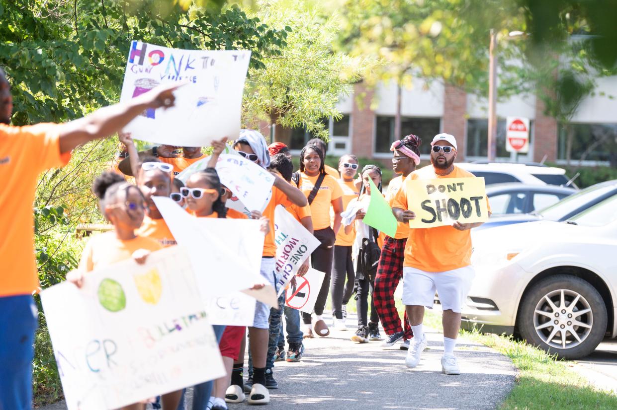 R.I.S.E. Freedom School students march in protest of gun violence during their Day of Social Action at Kellogg Community College on Wednesday, July 19, 2023.