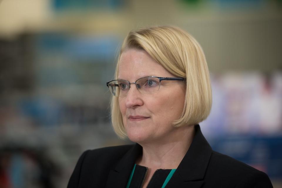 Ontario Health Minister Sylvia Jones listens to questions from reporters following a news conference at a Shoppers Drug Mart in Etobicoke on Jan. 11, 2023.