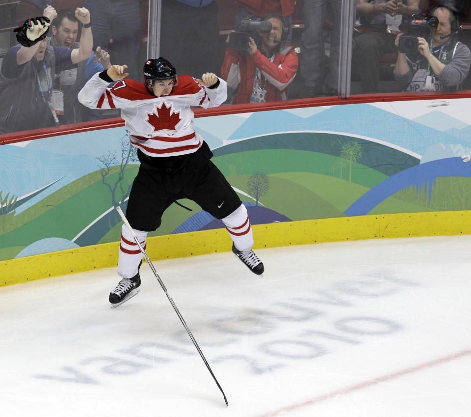 FILE - In this Feb. 28, 2010, file photo, Canada's Sidney Crosby leaps in the air after scoriung the game-winning goal in the overtime period of the men's gold medal ice hockey game against team USA at the Vancouver 2010 Olympics in Vancouver, British Columbia. Hockey Canada announced its 25-man hockey roster, loaded with NHL stars, for the Winter Olympics on Tuesday, Jan. 7, 2014, and Sid the Kid is going to have plenty of help. Joining Crosby, who scored the gold-medal winning goal in 2010 against the U.S., will be Jamie Benn, Patrice Bergeron, Jeff Carter, Matt Duchene, Ryan Getzlaf, Chris Kunitz, Patrick Marleau, Rick Nash, Corey Perry, Patrick Sharp, Steven Stamkos, John Tavares and Jonathan Toews. (AP Photo/Chris O'Meara, File)