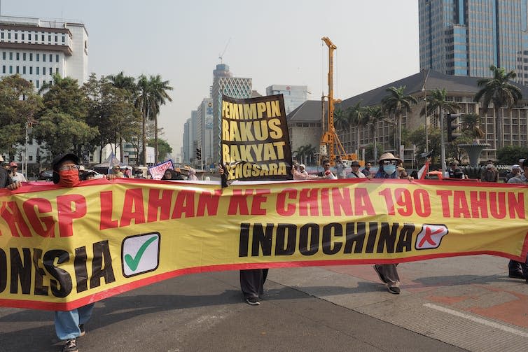 Protestors on the streets holding banners.