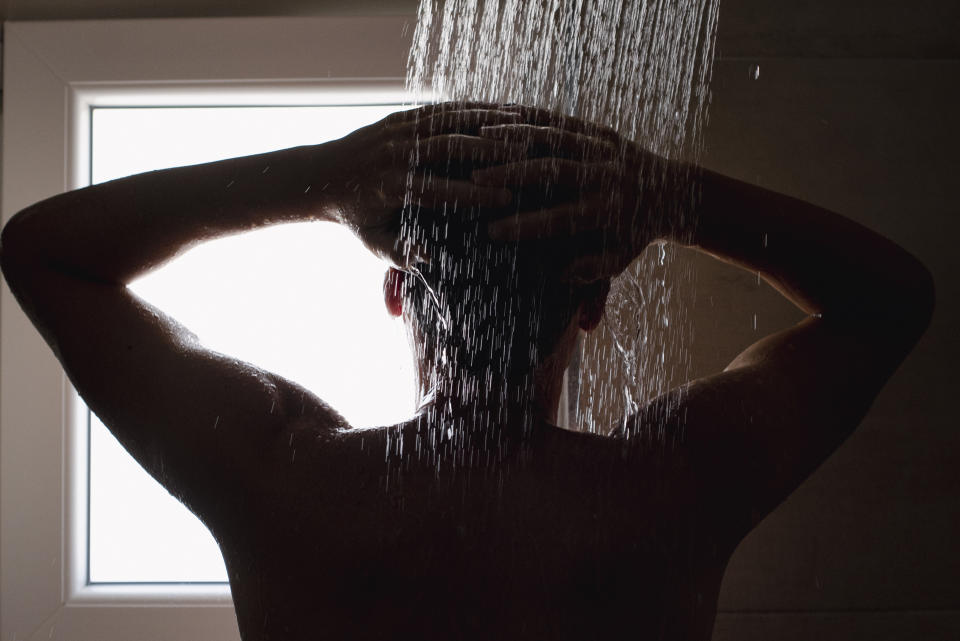 Close-up of a young man in the shower