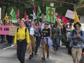 In this photo taken June 21, 2019, people demonstrating to raise awareness of climate change blocked streets in downtown Portland, Ore. The divide in Oregon between the state’s liberal, urban population centers and its conservative and economically depressed rural areas makes it fertile ground for the political crisis unfolding over a push by Democrats to enact sweeping climate legislation. Just three years after armed militia members took over a national wildlife refuge in southeastern Oregon, some of the same groups are now seizing on a walkout by Oregon’s GOP senators to broadcast their anti-establishment message. (AP Photo/Steven Dubois)
