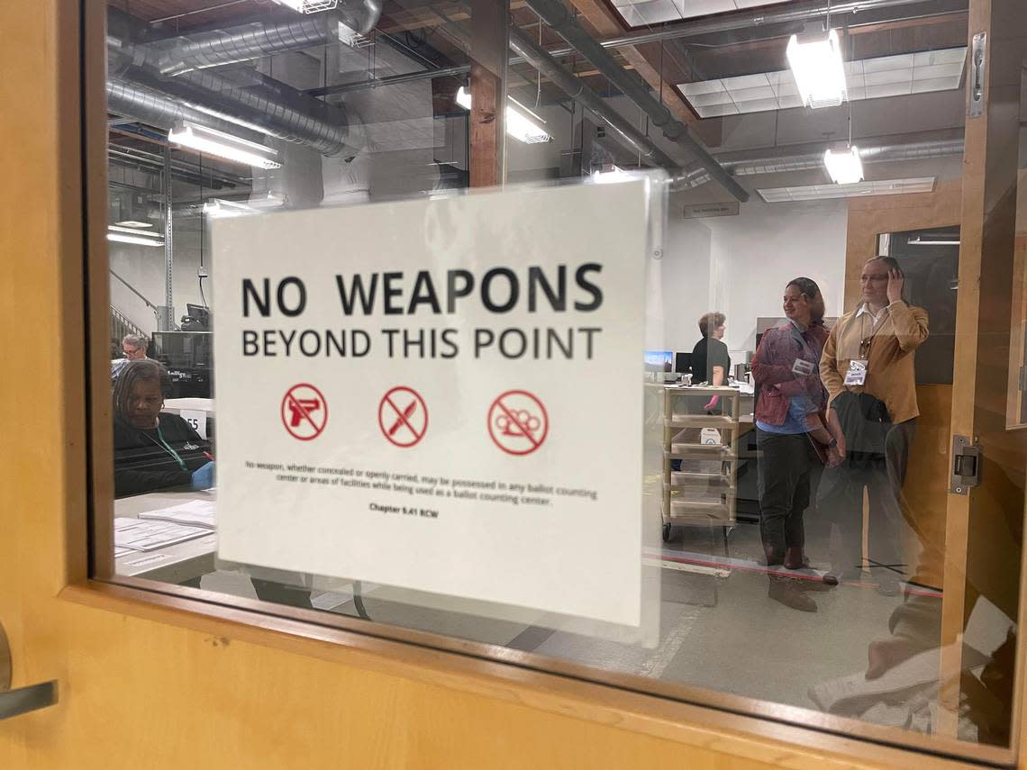 Commissioner of Public Lands candidate Sue Keuhl Pederson (right) observes the recount process of her race behind a secure door in the Pierce County Elections Center in Tacoma on Aug. 24, 2024.