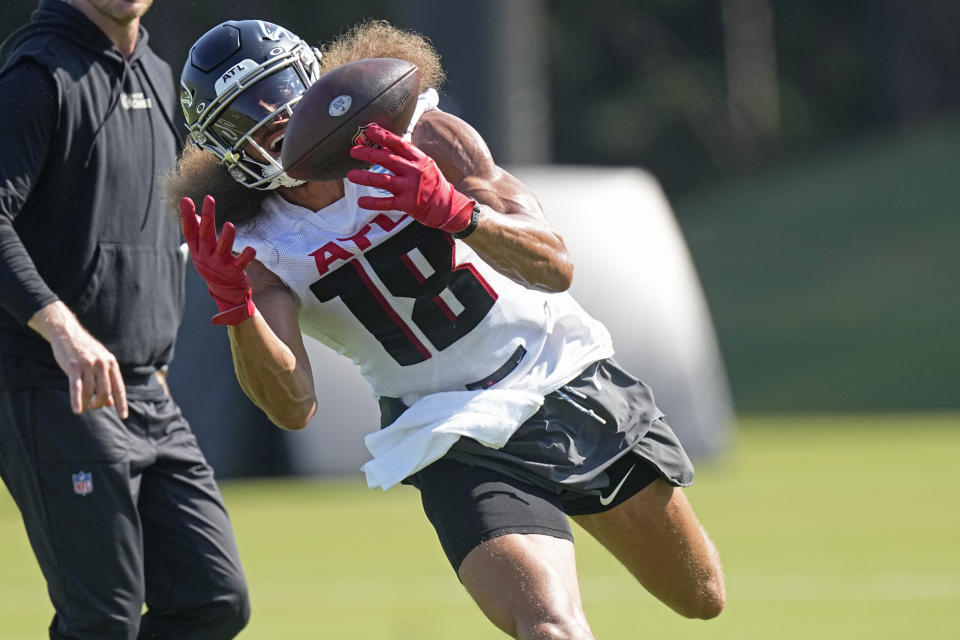 Atlanta Falcons wide receiver Mack Hollins (18) makes a catch during the first day of team's NFL football training camp pratice Wednesday, July 26, 2023, in Flowery Branch, Ga. (AP Photo/John Bazemore)