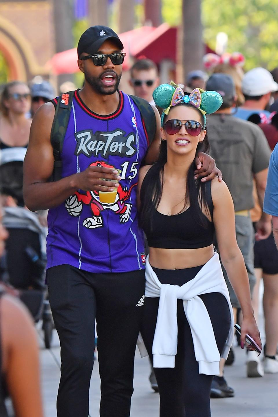 DeMario Jackson and Scheana Shay keep it cozy on Wednesday while at Disneyland in Anaheim, California, with the <em>Vanderpump Rules</em> cast. 