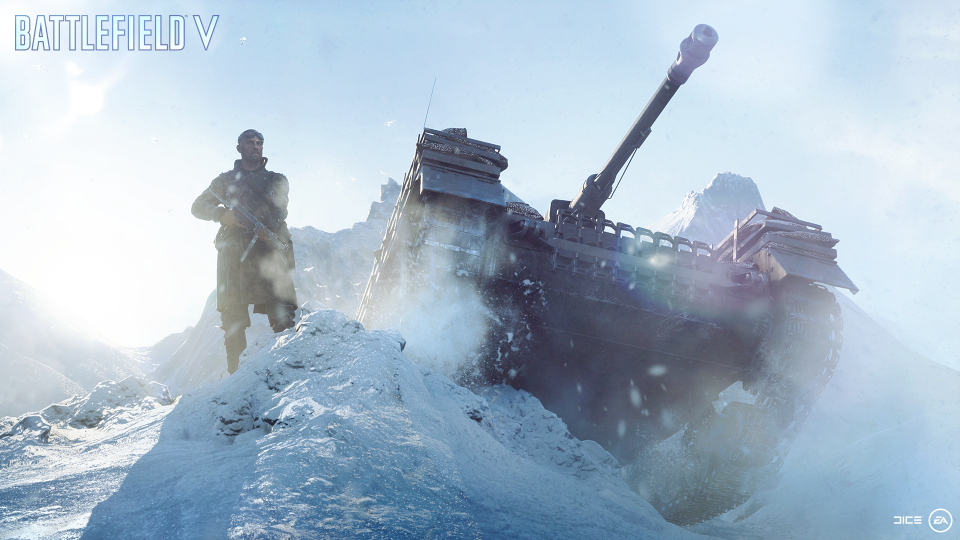 A soldier on the left with a tank on the right. Both are in snow.