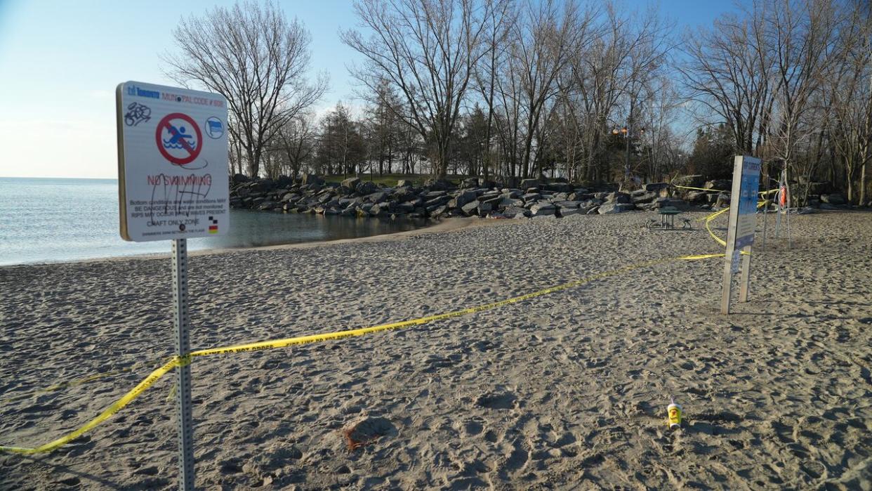 Police taped off a stretch of Ashbridges Bay where a teen boy disappeared in the water on Sunday. His body was recovered on Monday. (Paul Smith/CBC - image credit)