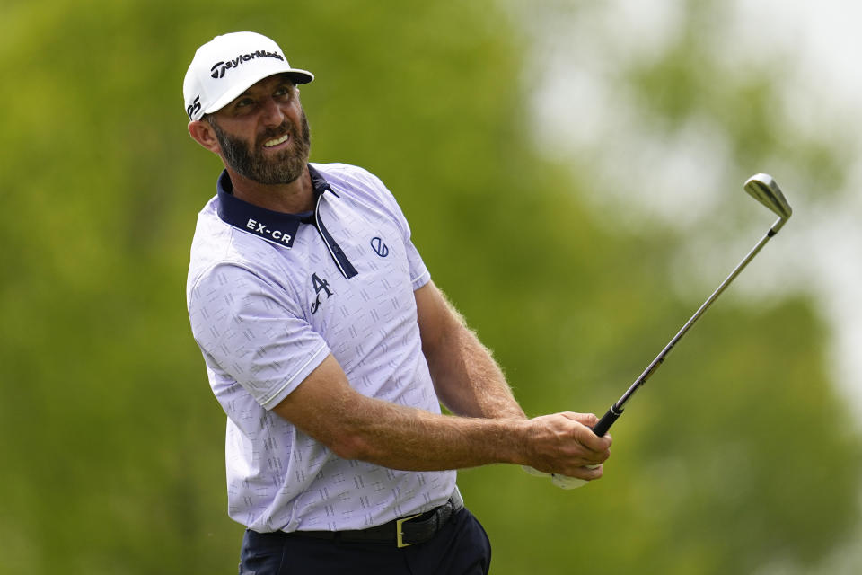 Dustin Johnson watches his tee shot on the seventh hole during the second round of the PGA Championship golf tournament at Oak Hill Country Club on Friday, May 19, 2023, in Pittsford, N.Y. (AP Photo/Abbie Parr)