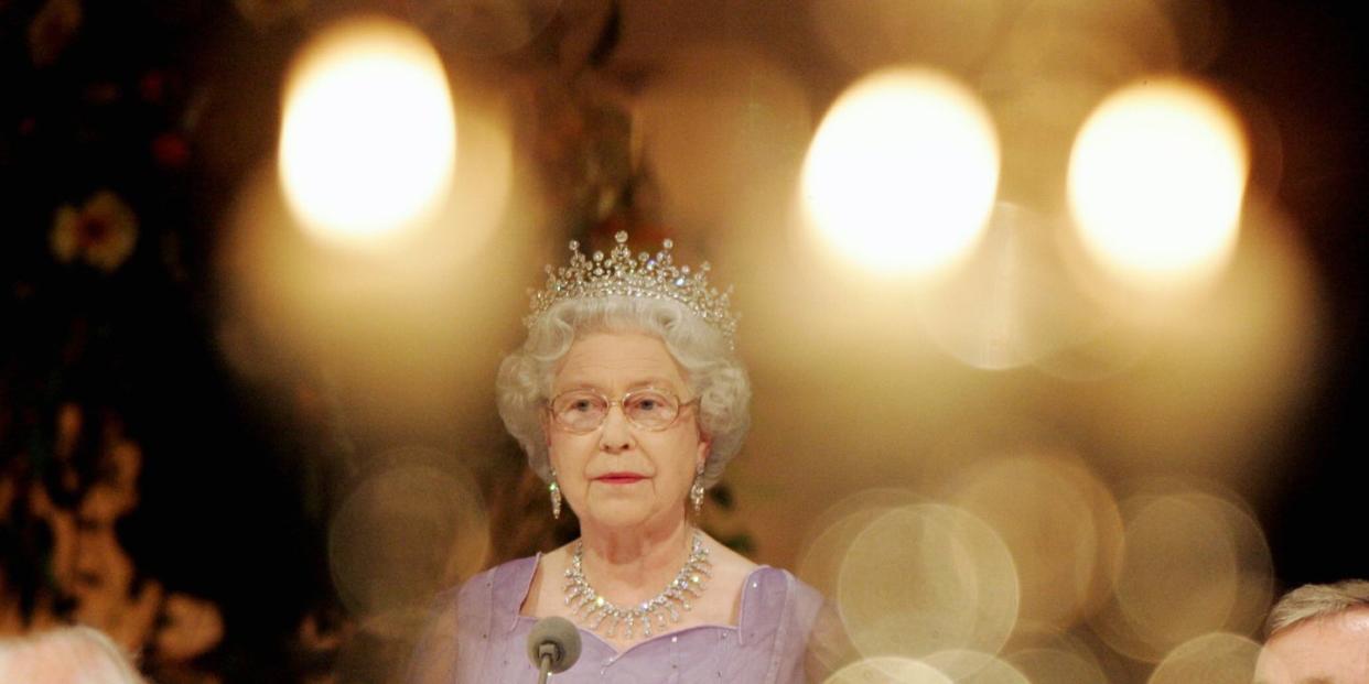 britain's queen elizabeth ii stands besi