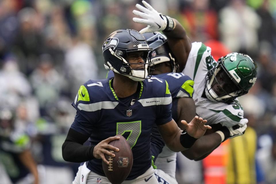 Seattle Seahawks quarterback Geno Smith looks to pass against New York Jets on Jan. 1.