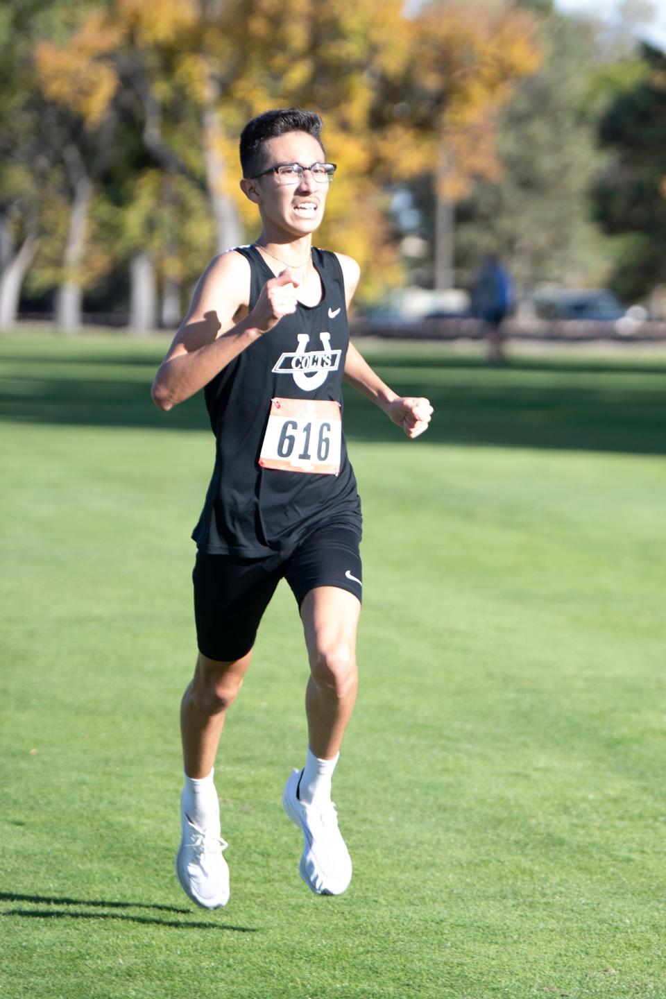 South High School's Andres Cura heads to the finish line at the Class 4A region 5 cross-country meet at Elmwood Golf Course on Thursday, Oct. 21, 2021.