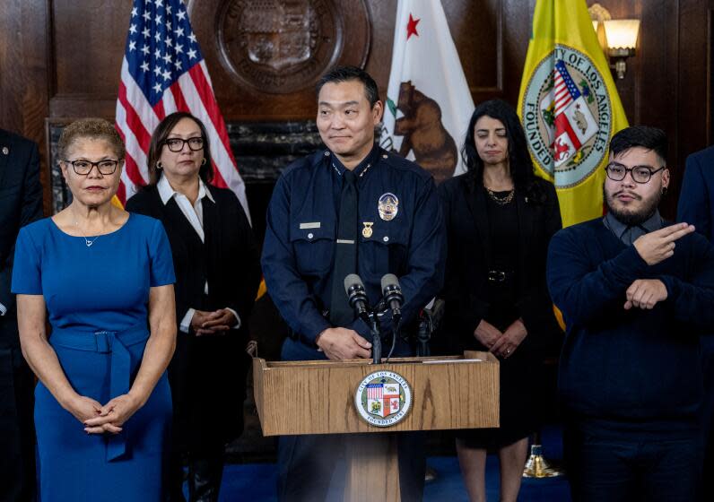 LOS ANGELES, CA - FEBRUARY 7, 2024: Dominic H. Choi has been named new LAPD interim chief at City Hall on February 7, 2024 in Los Angeles, California. Mayor Karen Bass is on the left.(Gina Ferazzi / Los Angeles Times)