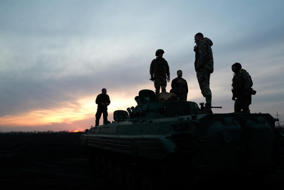 Soldiers stand on the Armoured Infantry Vehicle 2 (BMP-2) on the road to the city, on the outskirts of Avdiivka (Getty)