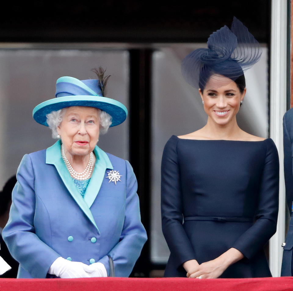 Meghan, Duchess of Sussex, pictured with Queen Elizabeth, is losing her royal title in the Spring after she and Prince Harry decided to scale back on their royal duties. (Photo: Max Mumby/Indigo/Getty Images)