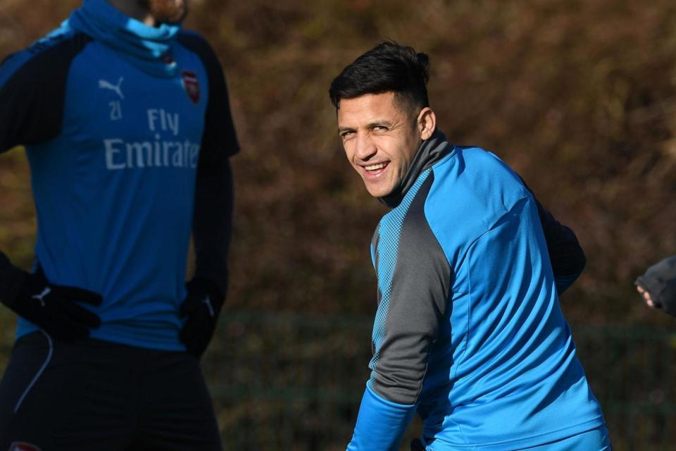 Alexis Sanchez pictured outside Old Trafford... on a Manchester United scarf