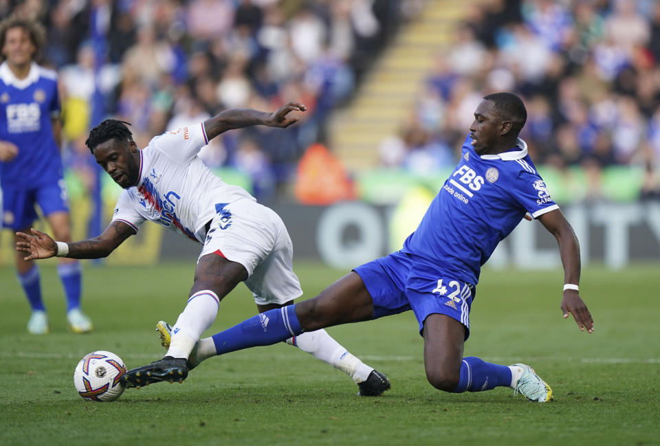 Crystal Palace's Eberechi Eze and Leicester City's Jeffrey Schlupp, right, battle for the ball during the Premier League match between Leicester City and Crystal Palace at the King Power Stadium in Leicester, Britain, Saturday Oct. 15, 2022. (Tim Goode/PA via AP)