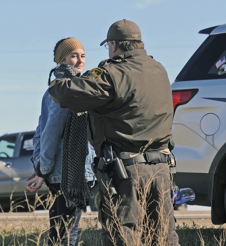 A Morton County Sheriff's deputy officer arrests actress Shailene Woodley at a protest against the Dakota Access Pipeline