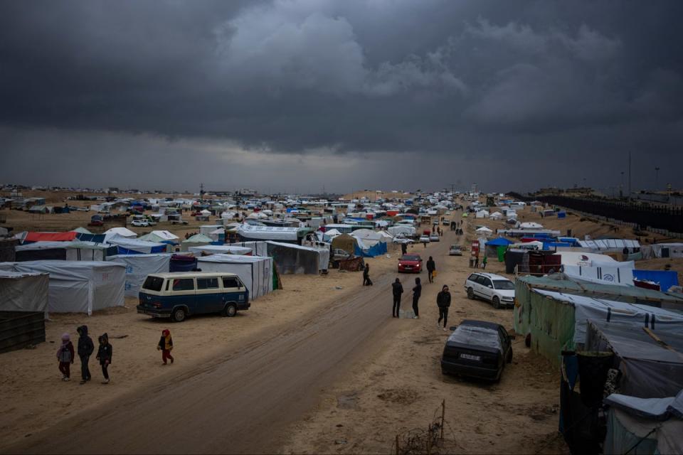 Palestinians displaced by the Israeli air and ground offensive on the Gaza Strip in a makeshift camp in Rafah (AP)