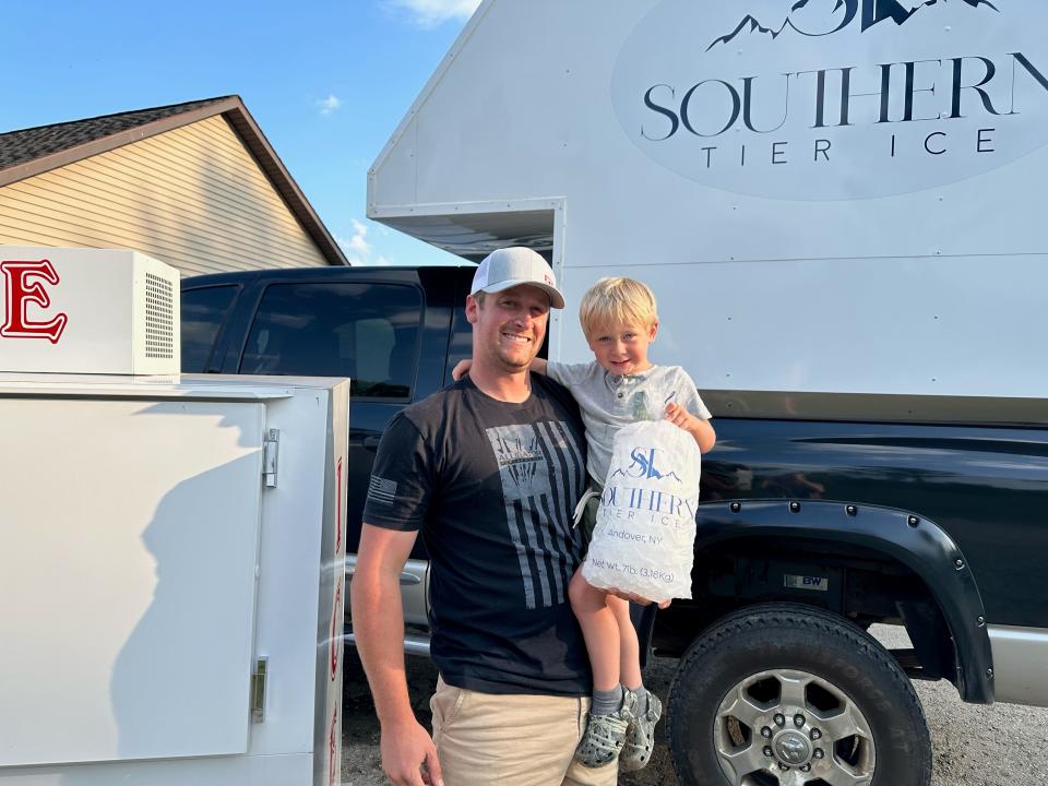 Ryan Knapp, owner of Southern Tier Ice LLC, with his son, 2-year-old Henry.